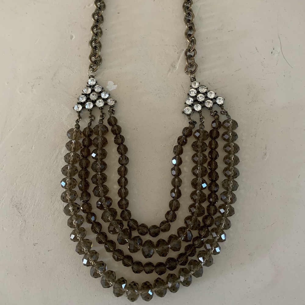Taupe faceted beaded 4 strand necklace.